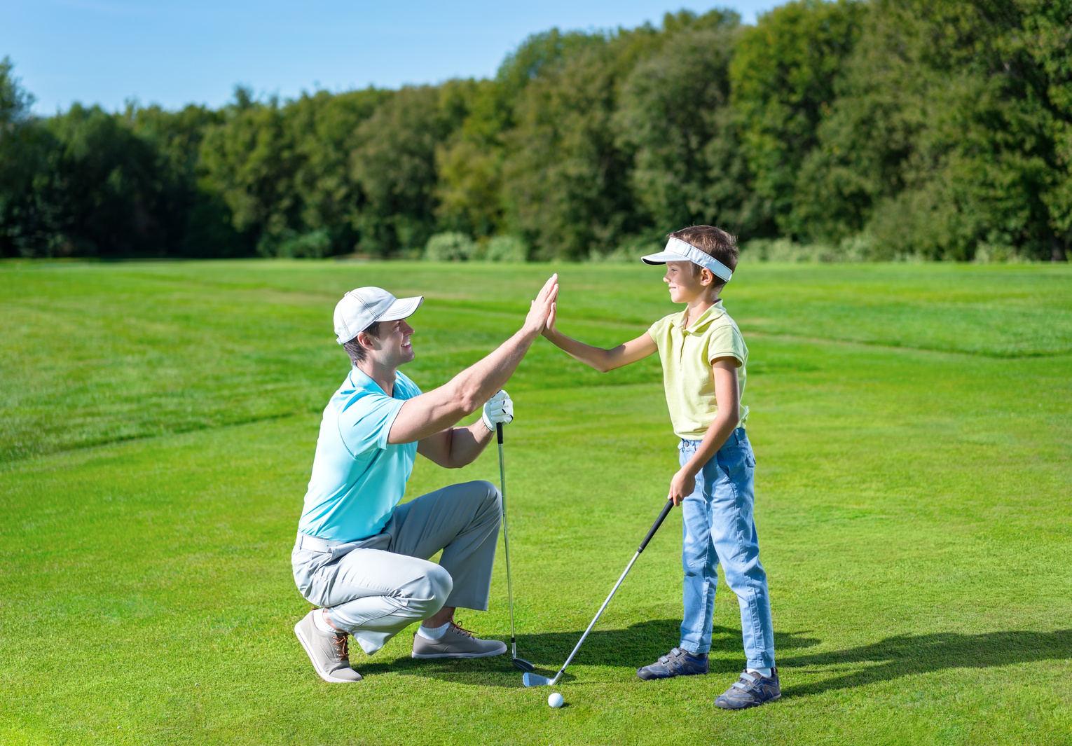 Father and Son Playing Golf