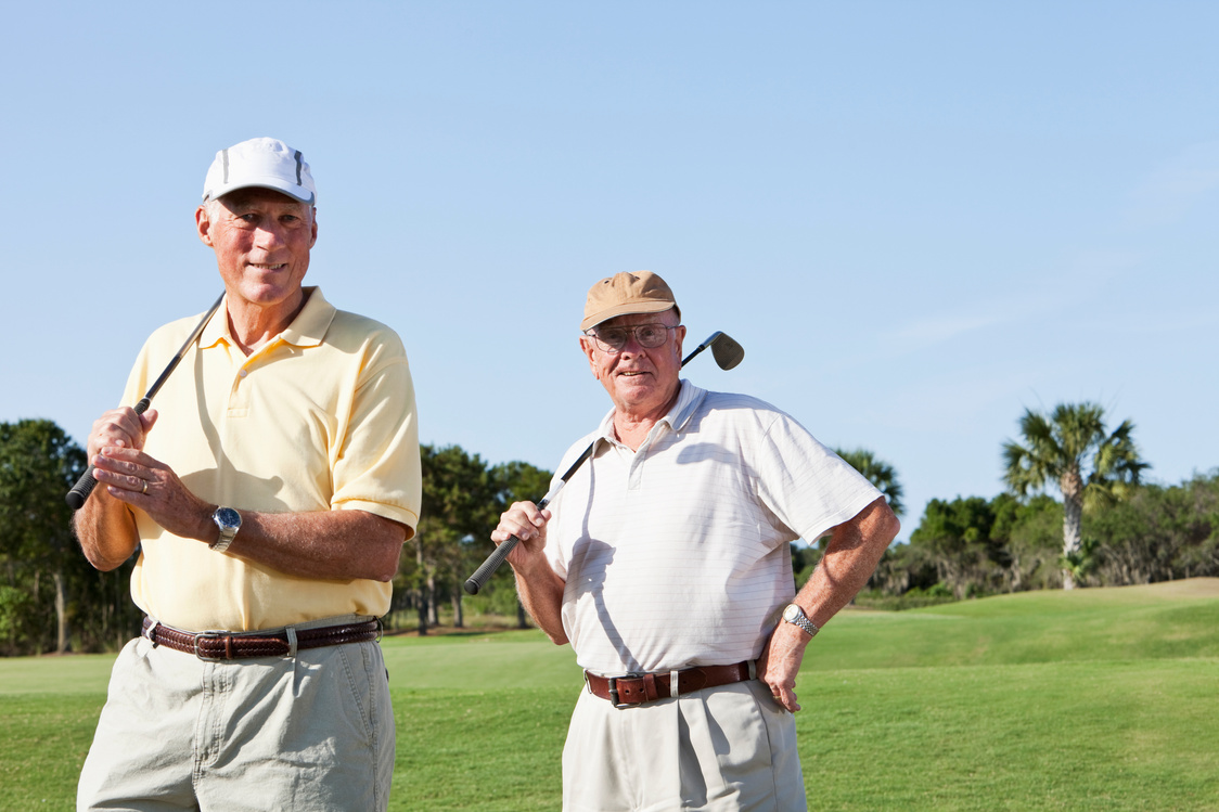 Senior men playing golf.