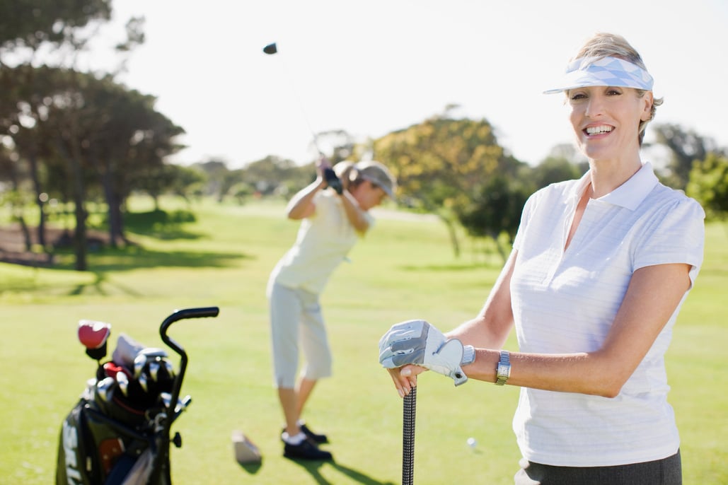 Women playing golf