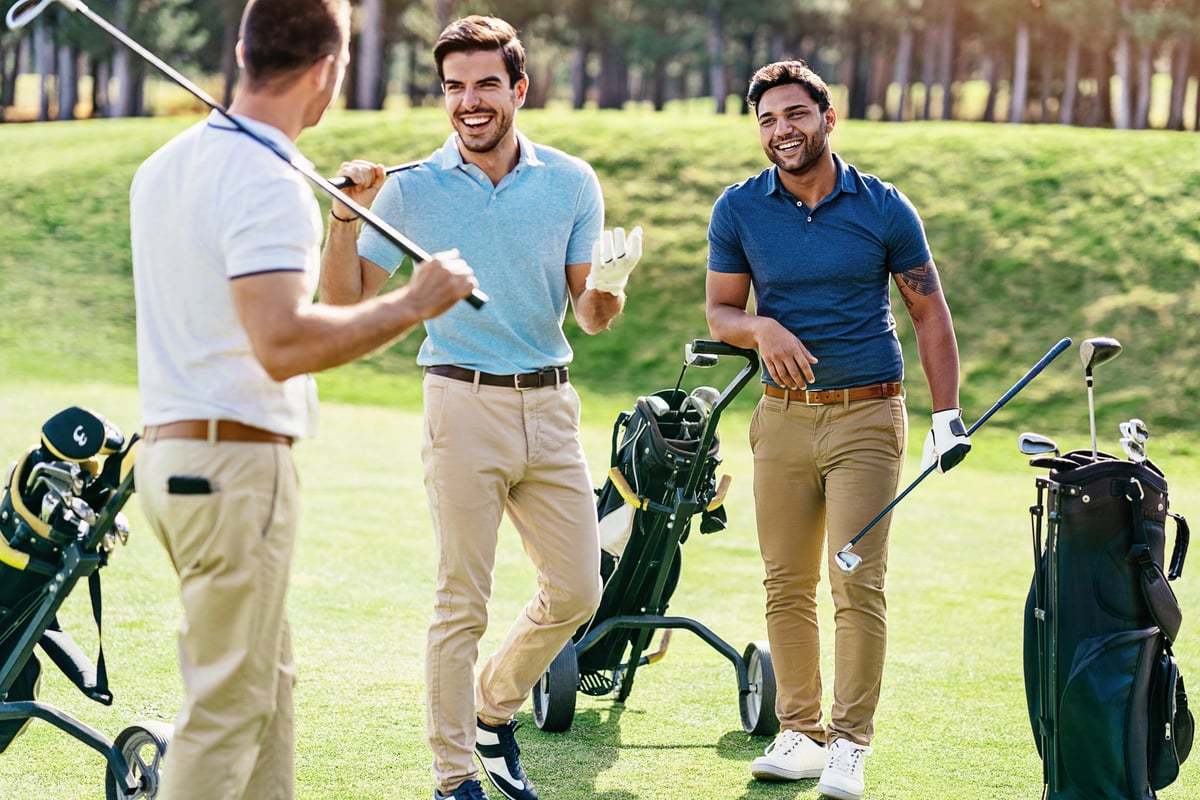 Group of men playing golf on a sunny day